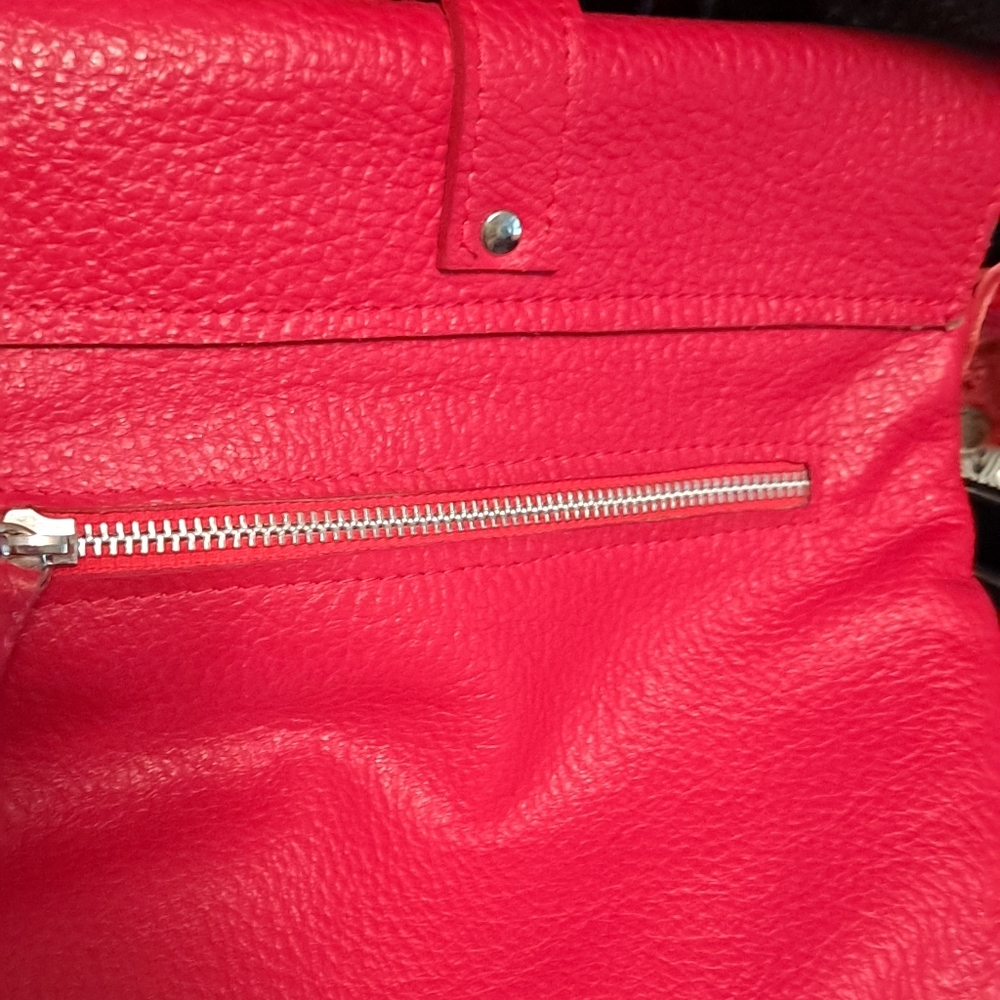 New buttery leather red crossbody. Snap Closure. Clean Inside. 1 Pocket In/out.